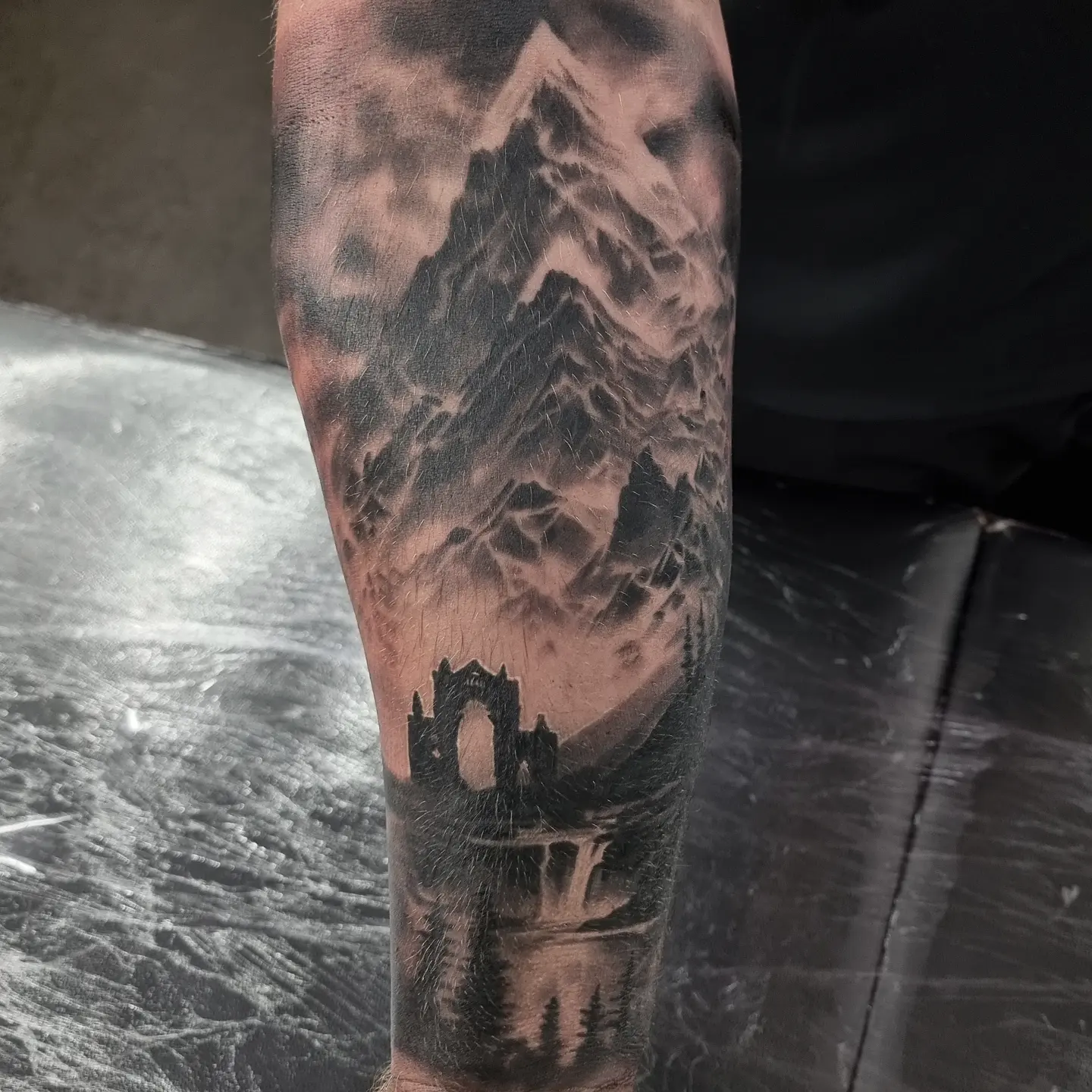 Black and grey realism nature and landscape tattoo by Tomek Turlej, Edinburgh