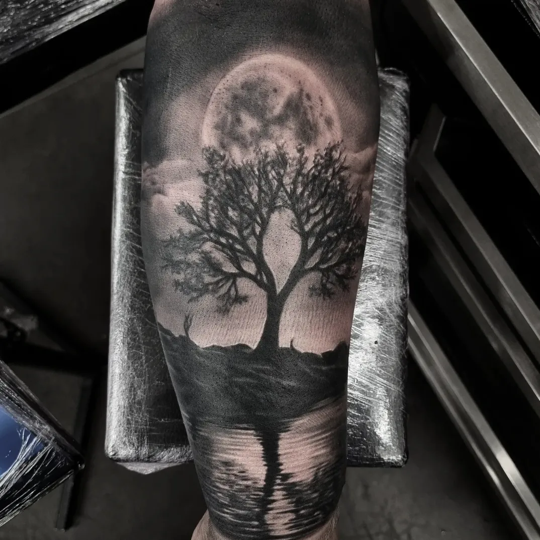 Realistic black and grey landscape tattoo by Tomek Turlej at Studio XIII Gallery Edinburgh