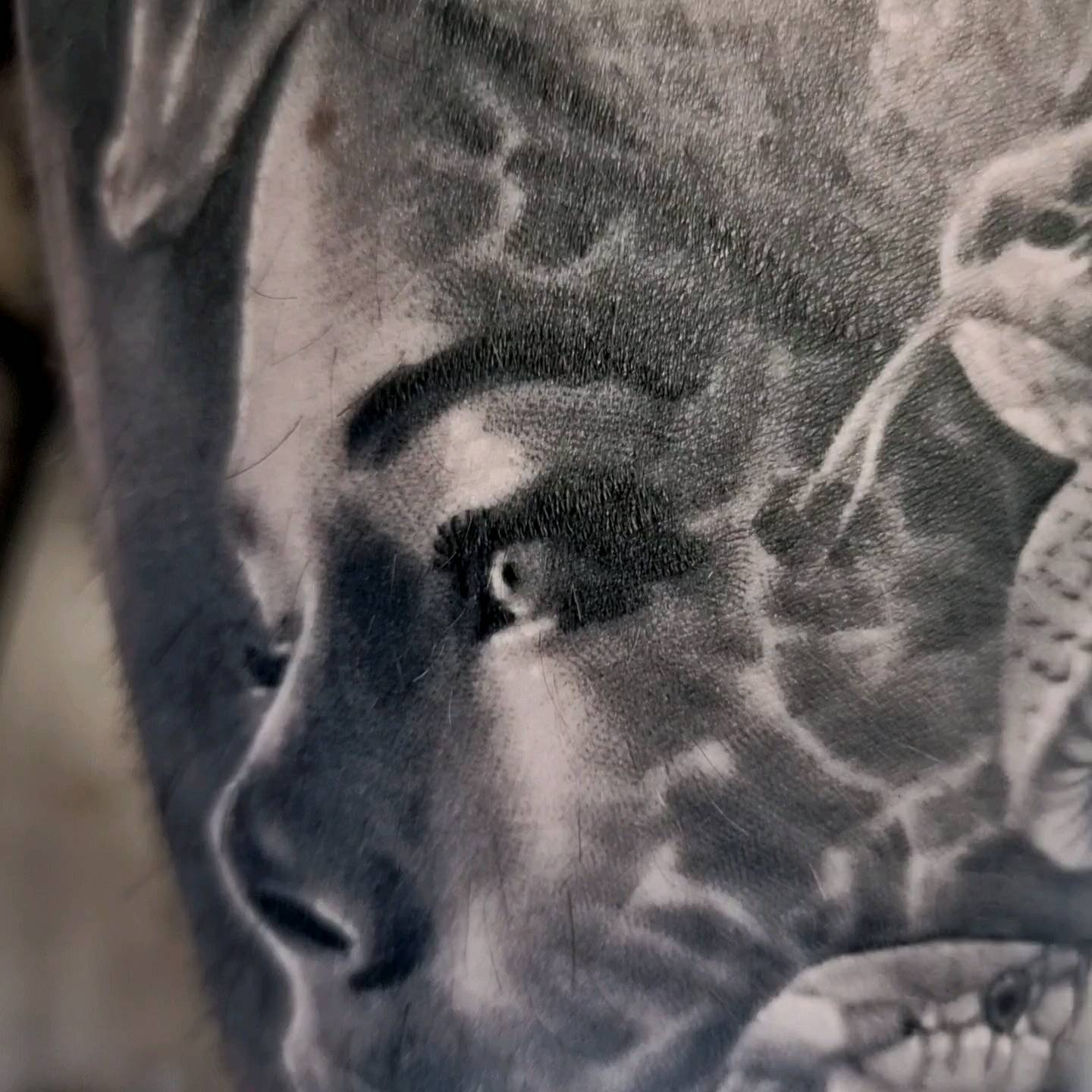 Photorealistic black and grey portrait tattoo by Tomek Turlej, Studio XIII Gallery, Scotland