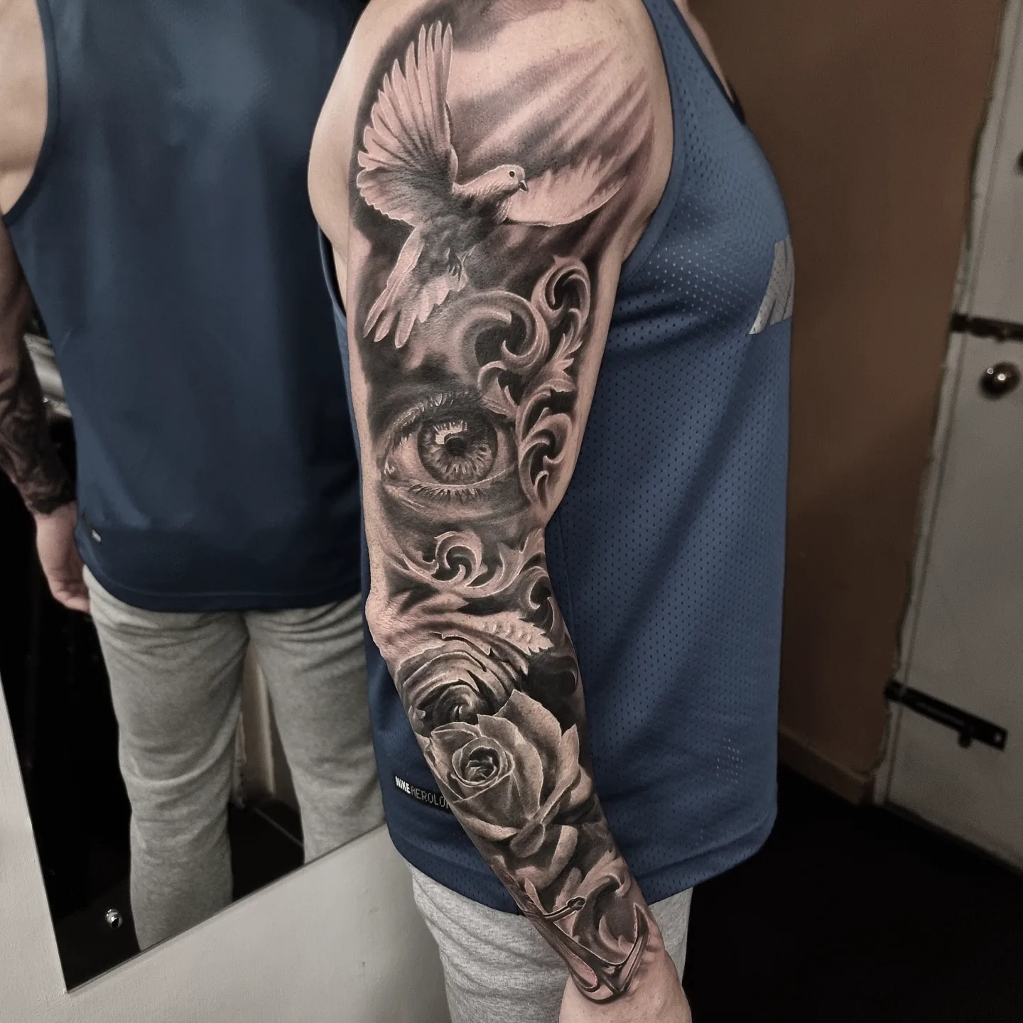 Large scale black and grey sleeve tattoo by Tomek Turlej, Studio XIII Gallery, Scotland