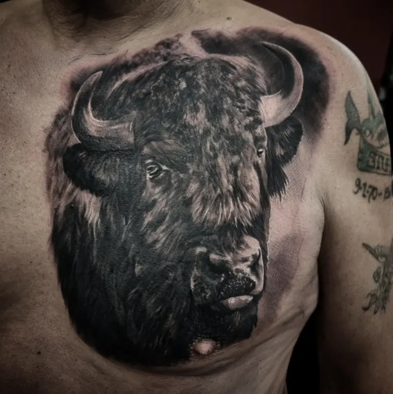 Realistic black and grey wildlife tattoo by Tomek Turlej at Studio XIII Gallery Edinburgh