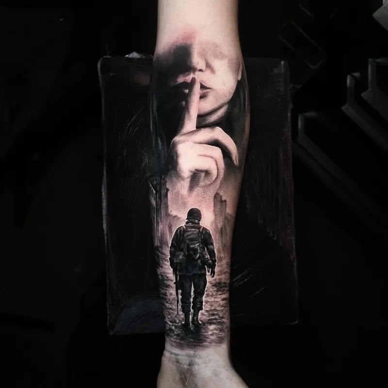 Dark surreal black and grey tattoo of a face and lone figure by Tomek Turlej, Edinburgh