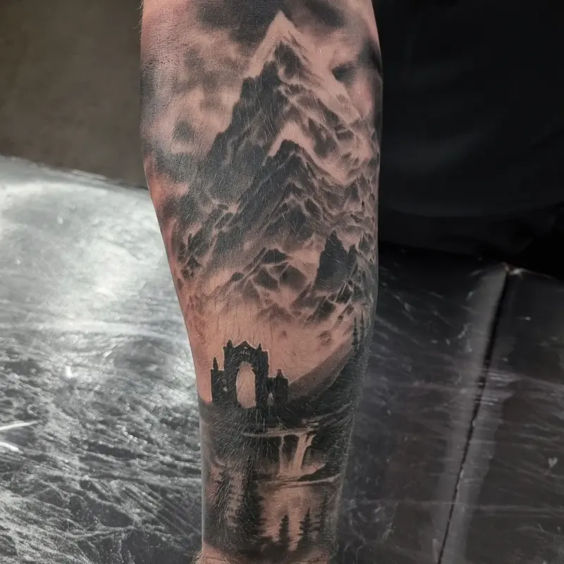 Black and grey realism nature and landscape tattoo by Tomek Turlej, Edinburgh