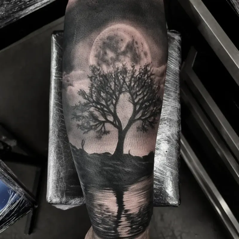 Realistic black and grey landscape tattoo by Tomek Turlej at Studio XIII Gallery Edinburgh