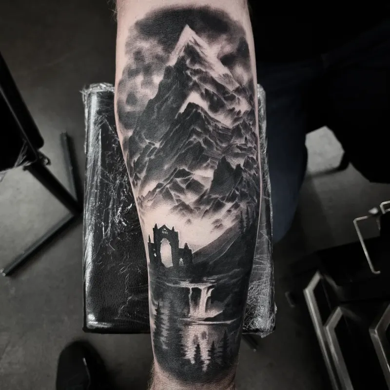 Photorealistic black and grey scenery tattoo by Tomek Turlej, Studio XIII Gallery, Scotland