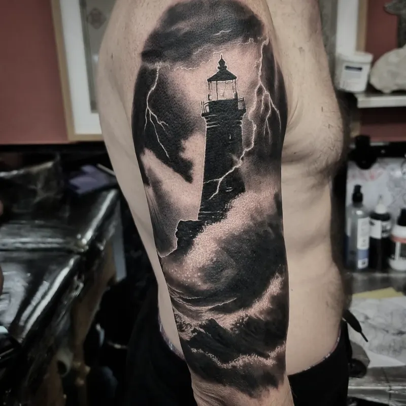 Realistic black and grey landscape tattoo by Tomek Turlej at Studio XIII Gallery Edinburgh