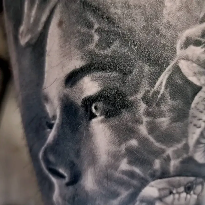 Photorealistic black and grey portrait tattoo by Tomek Turlej, Studio XIII Gallery, Scotland