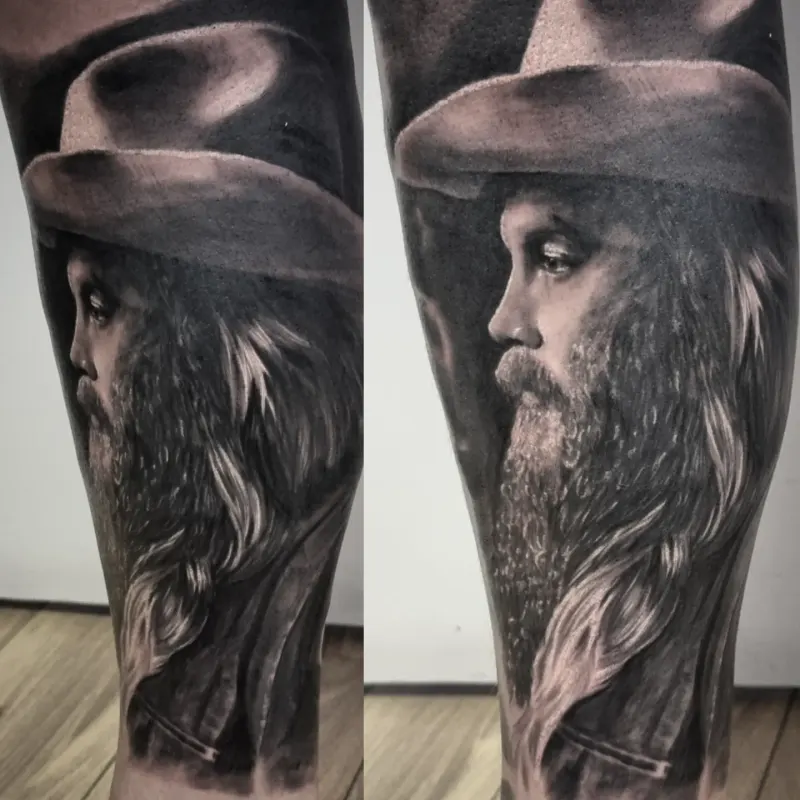 Black and grey realism portrait tattoo by Tomek Turlej, tattoo artist in Edinburgh