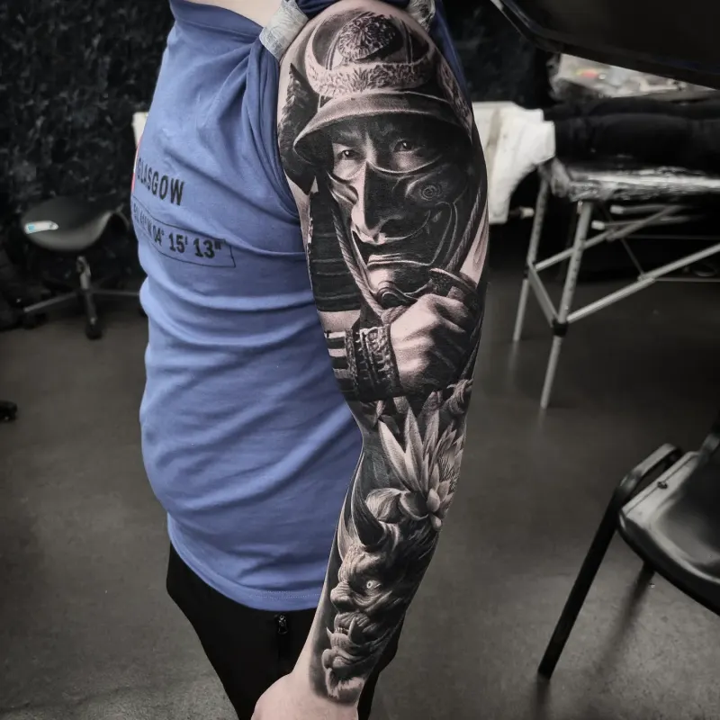 Black and grey full sleeve tattoo by Tomek Turlej at Studio XIII Gallery Edinburgh