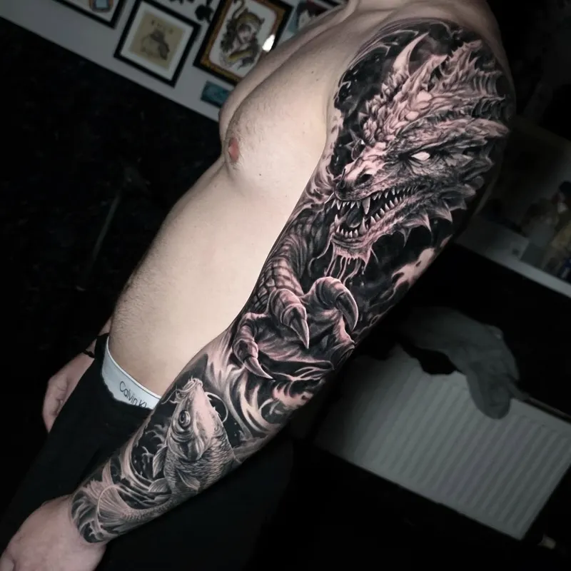 Custom black and grey realism sleeve by Edinburgh tattoo artist Tomek Turlej