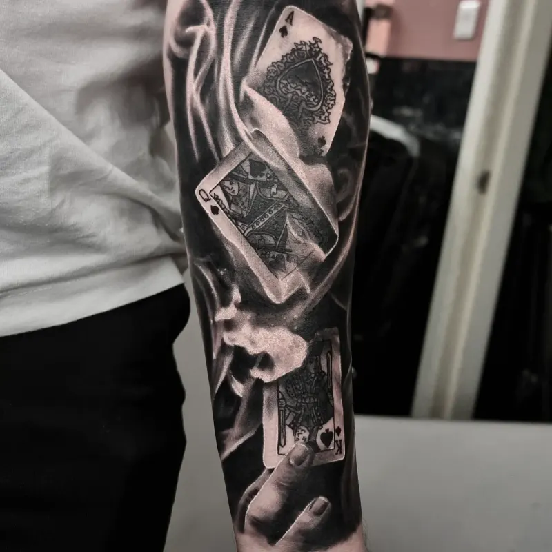 Full black and grey realism sleeve tattoo by Tomek Turlej, Edinburgh