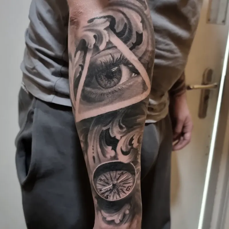 Large scale black and grey sleeve tattoo by Tomek Turlej, Studio XIII Gallery, Scotland